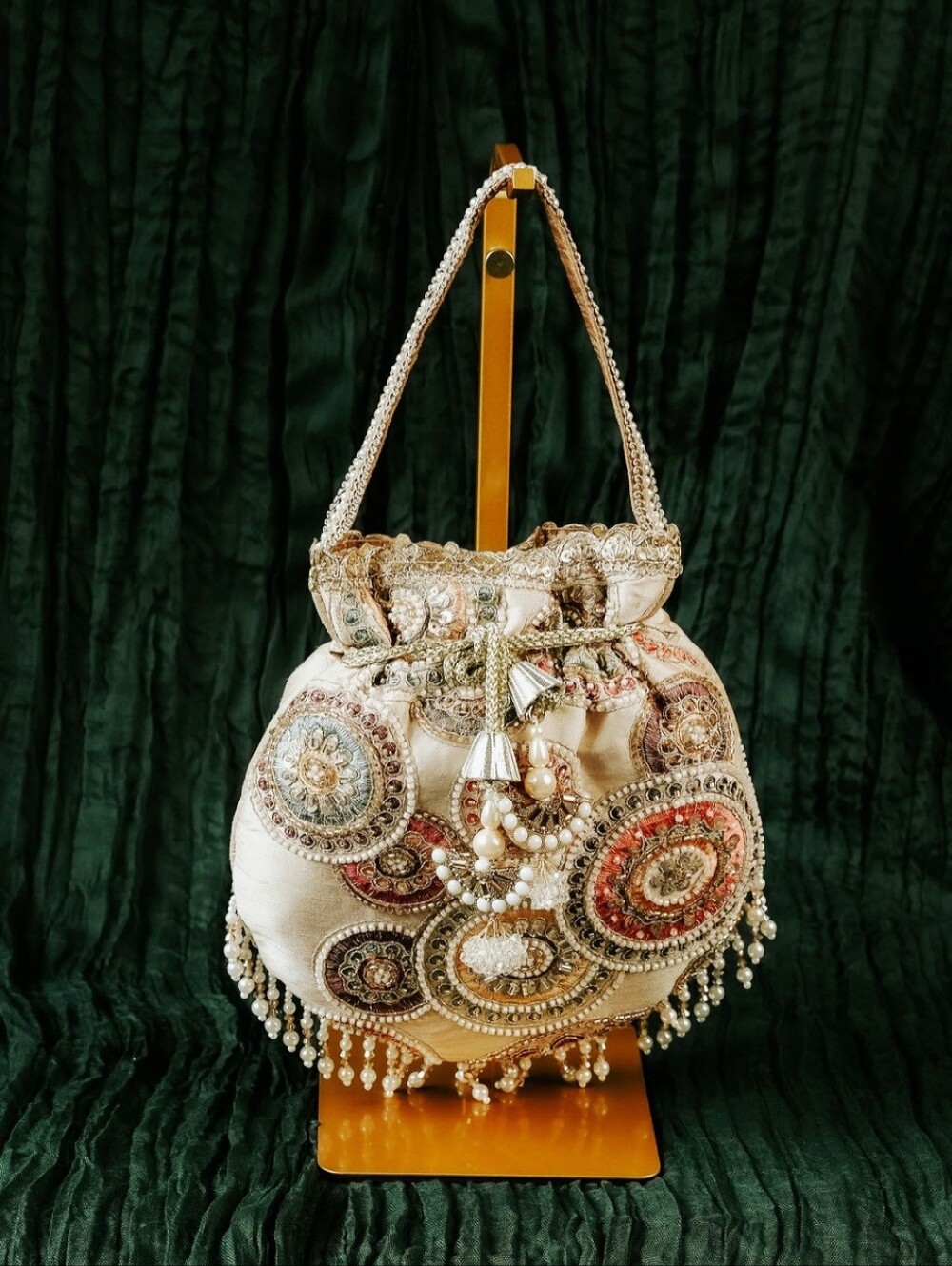 Embellished Drawstring Potli Bag in Ivory with Multicolor Embroidery